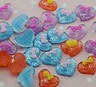 ORECCHINI A FORMA DI CUORE CON FIOCCHETTO SOPRA VARI COLORI