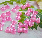 ORECCHINI A FORMA DI FIOCCHETTO COLORE ROSA